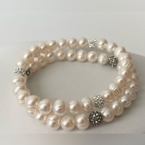 Swarovski Crystal Ball And
Genuine Freshwater Pearl Stretch
Bracelets